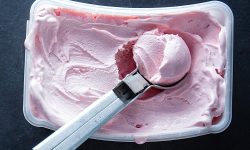 Easy Dairy-Free Homemade strawberry ice cream in plastic container
